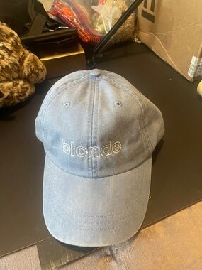 Adam’s blonde blue baseball hat